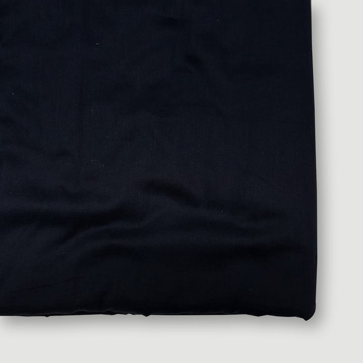 Soft and breathable navy blue Mul-Mul plain cotton fabric, ideal for creating comfortable and stylish garments.