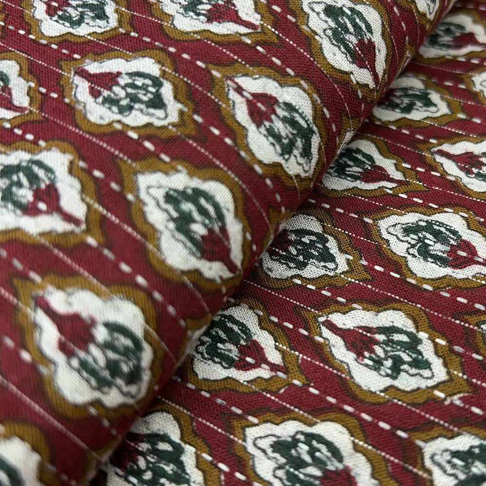 Traditional maroon shade floral cotton Kantha fabric, exuding cultural richness and artisanal charm for bespoke clothing.