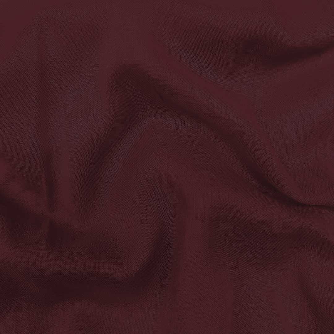 Plush royal maroon mul mul plain cotton fabric, offering unmatched softness and a rich hue for elegant and comfortable garments.