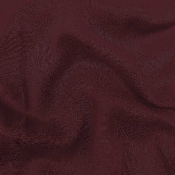 Plush royal maroon mul mul plain cotton fabric, offering unmatched softness and a rich hue for elegant and comfortable garments.