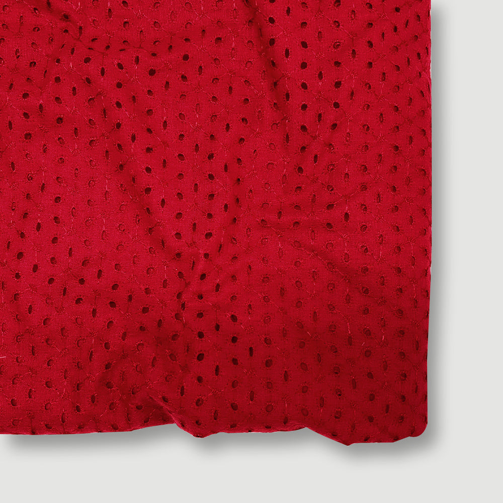 Vibrant red Hakoba cotton fabric with intricate embroidery and eyelet details