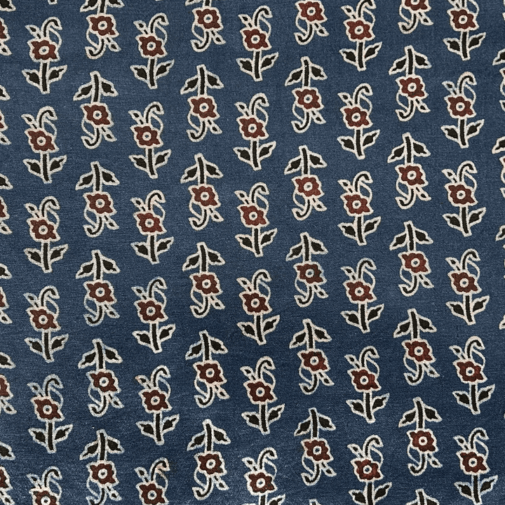 Ocean blue Mashru silk adorned with delicate floral Ajrakh patterns, ideal for refined and elegant apparel at Fabrics @StudioLCX.