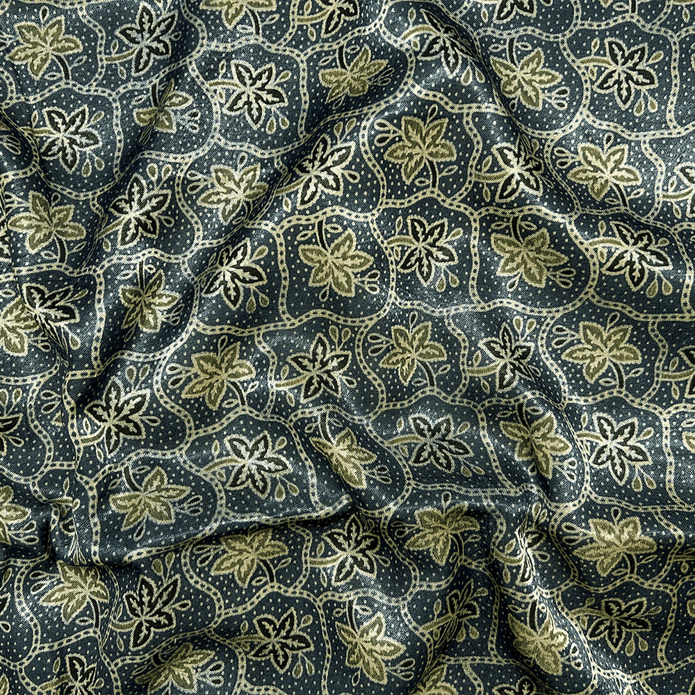 Navy blue silk fabric with green-shaded floral Ajrakh print, embodying traditional artistry at Fabrics @StudioLCX.