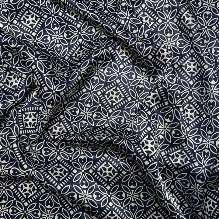 Sophisticated navy blue Mashru silk fabric with intricate floral prints for premium fashion crafting at Fabrics @StudioLCX.