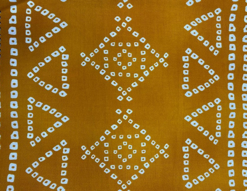 Vibrant mustard yellow with traditional Bandhani print on rayon fabric, ideal for crafting stylish and comfortable apparel.